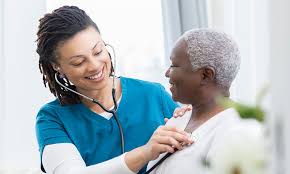 Doctor taking a pulse on a patient with a stethoscope
