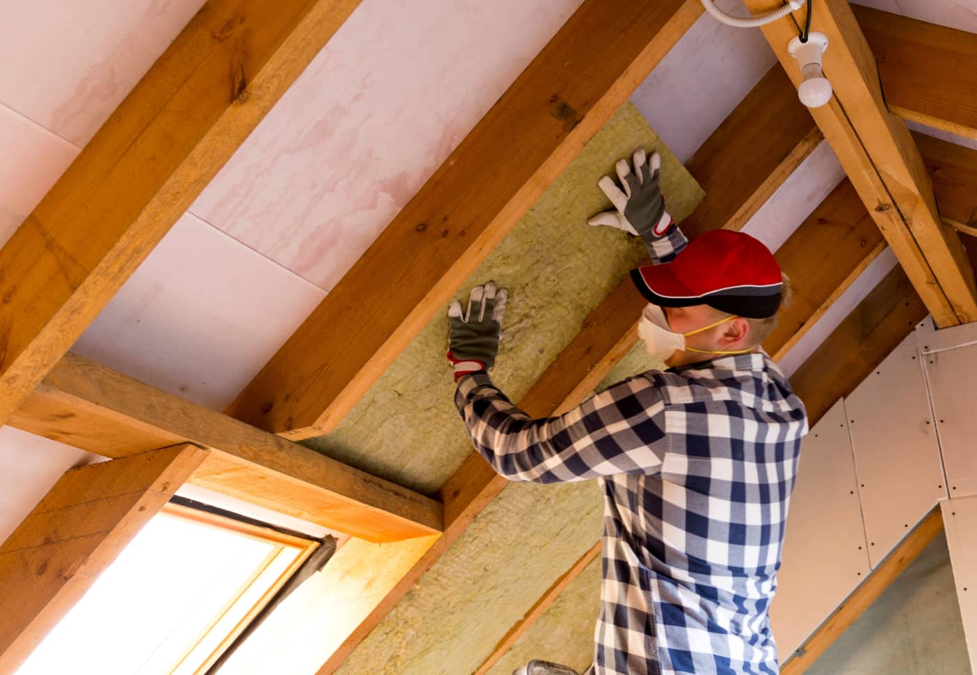 Man building a roof for his house