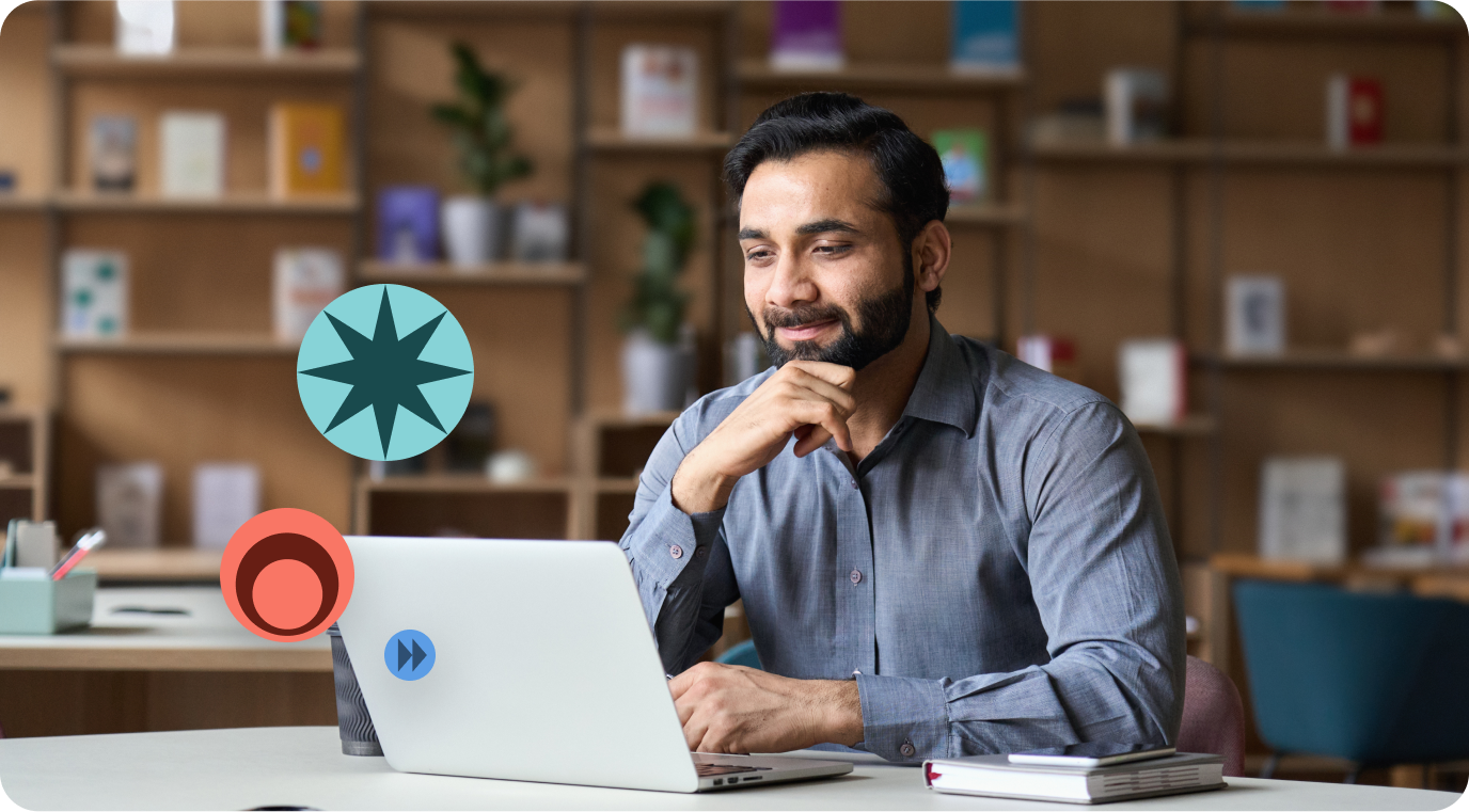 Man viewing his laptop cheerfully smiling